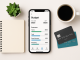 "Smartphone with financial planning app and accessories – concept of using free tools to master your money."